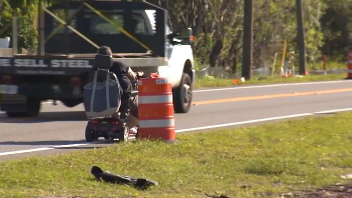 No sidewalk, no safe route: Eatonville man rides scooter alongside traffic as county widens road