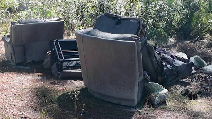 Illegal dumping persists on dirt roads near Paisley despite cemetery cleanup