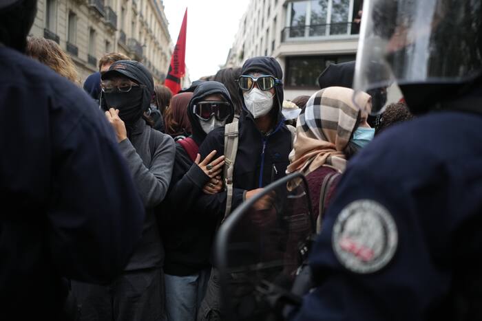Police use tear gas against protesters at Paris high school