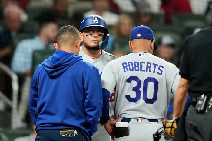 Dodgers hold out Rojas with back injury in playoff game