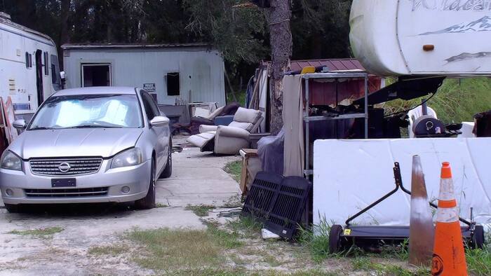 Marion County moves to foreclose on Summerfield property buried in junk