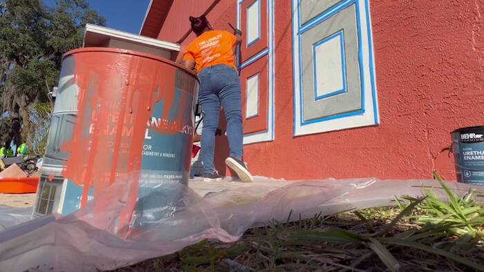 Volunteers paint 14 homes in Tildenville, helping preserve family legacies