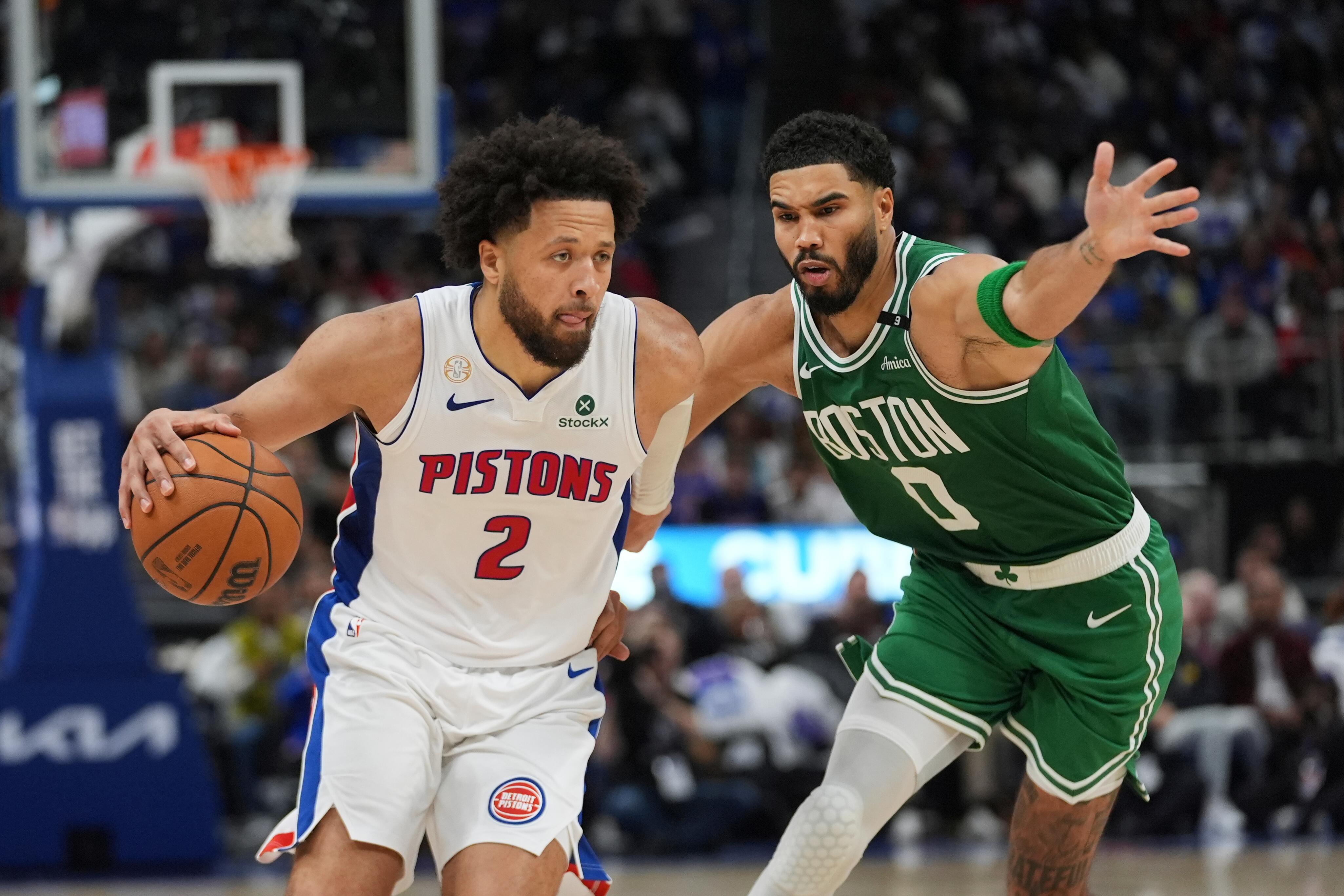 Detroit Pistons guard Cade Cunningham drives past Boston Celtics forward Jayson Tatum during the October 20 2026 NBA opening-day game