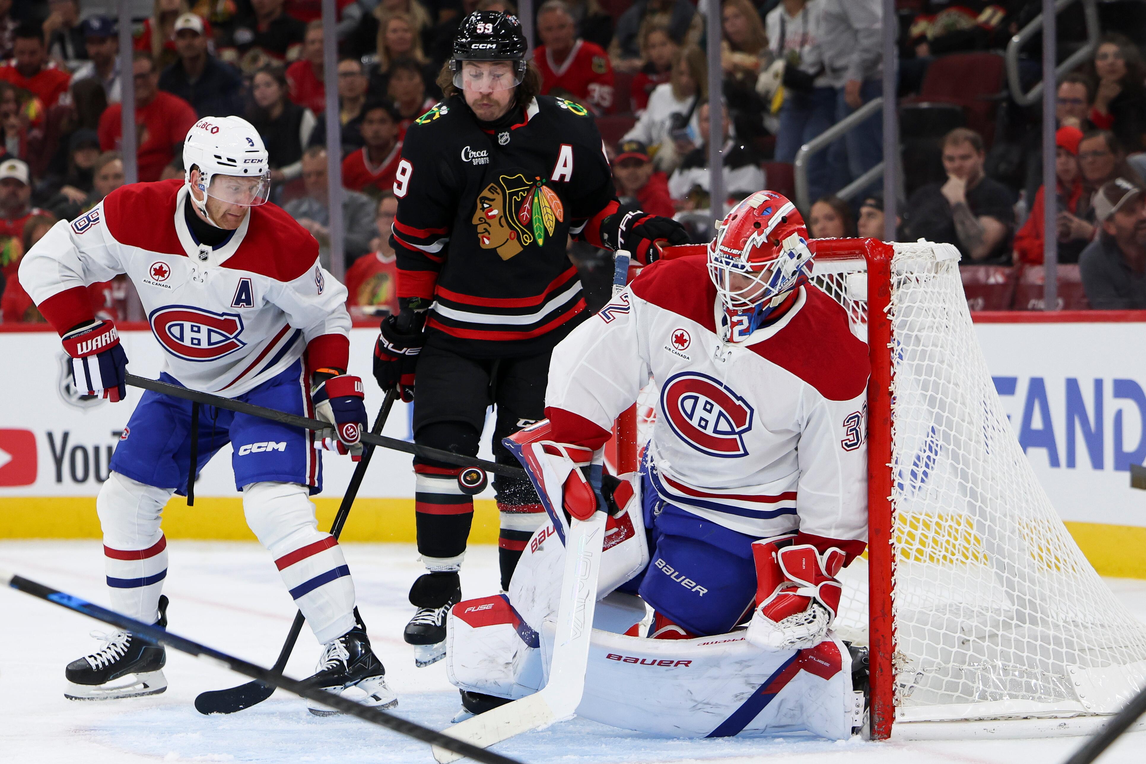 Montreal goaltender Jacob Fowler making a save with Mike Matheson nearby against Chicago October 23, 2026