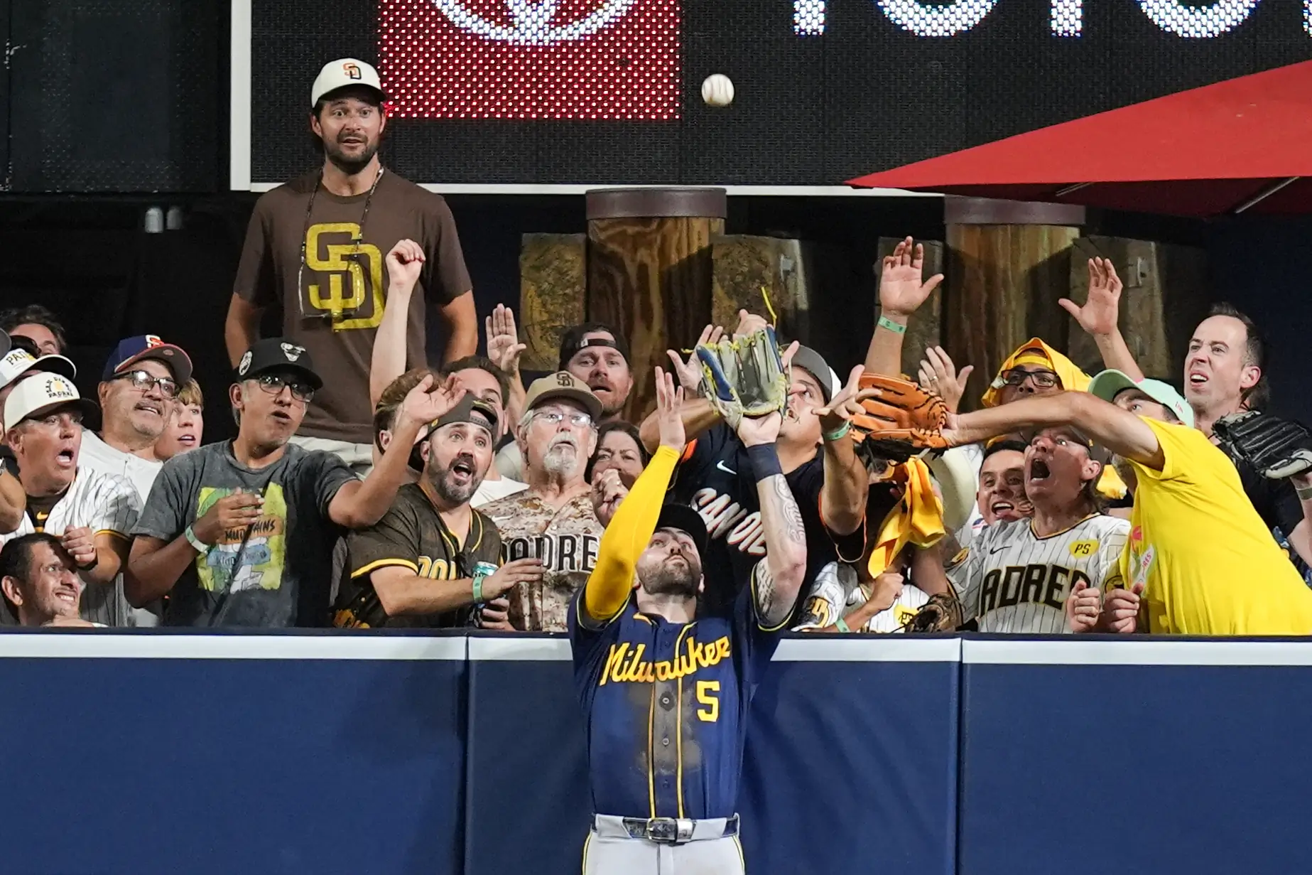 Garrett Mitchell catches Manny Machado's long eighth-inning fly ball against the Petco Park wall in the 2026 Brewers Padres NLDS Game 4