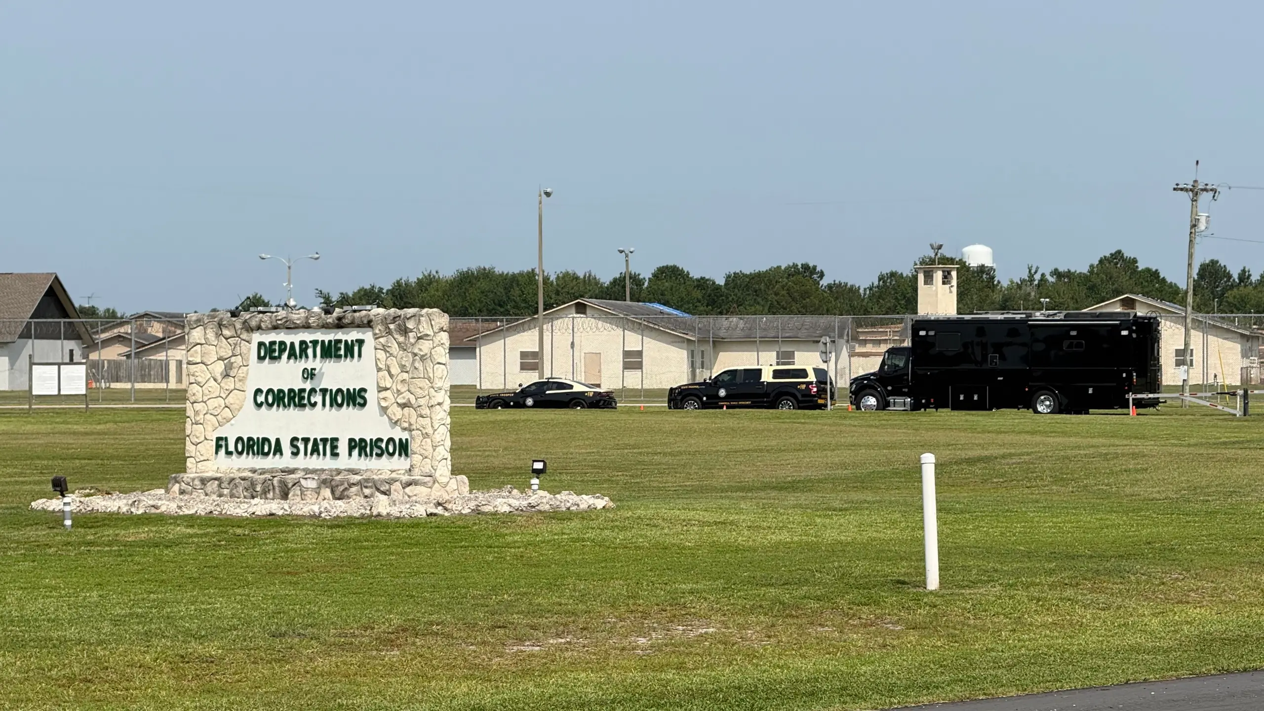 FILE — Law enforcement vehicles are parked outside the Florida State Prison in Starke, Florida, Tuesday, July 28, 2026. (AP Photo/David Fischer, File)
