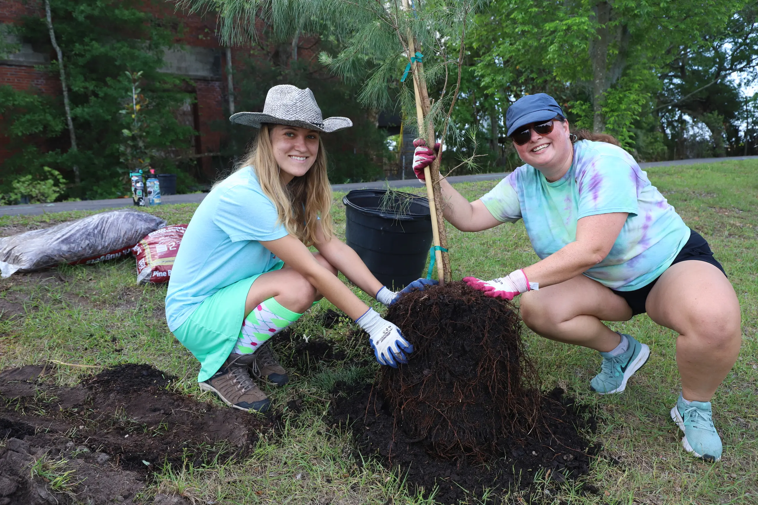 Volunteers plant 60 trees along Emerald Trail S-Line to add beauty, shade