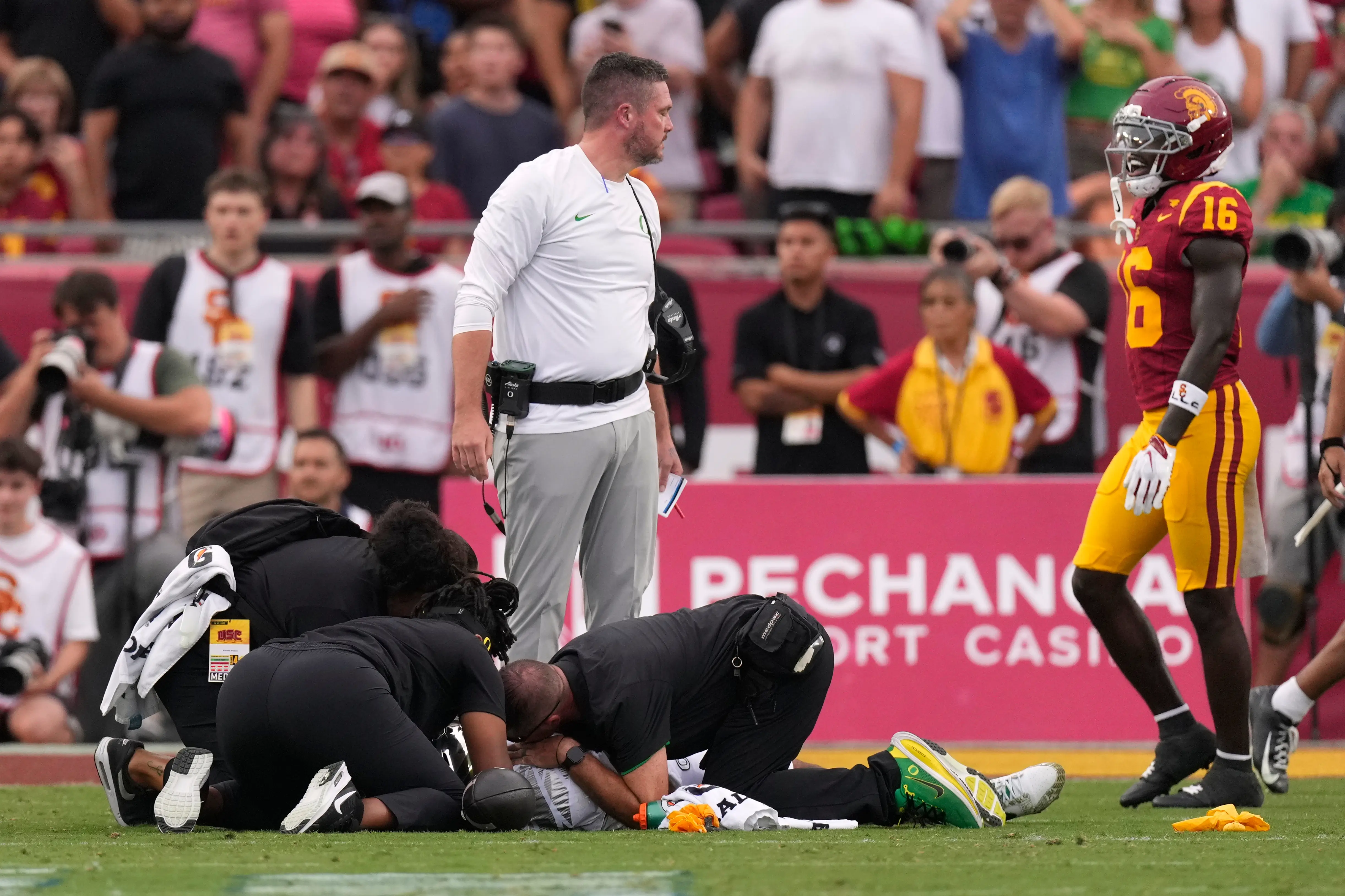 Oregon QB Dante Moore leaves field in ambulance after late hit. His Ducks rally for a stirring win