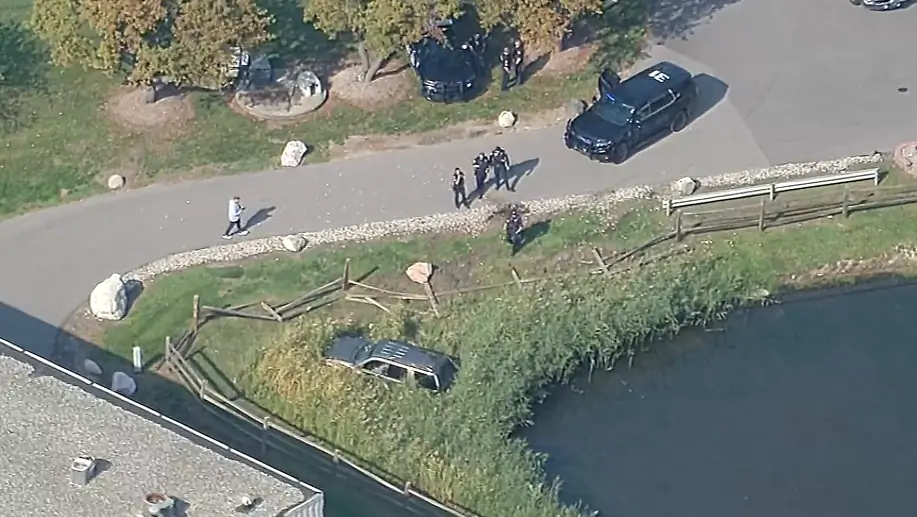 Car rolls into pond during apparent police chase in Macomb County