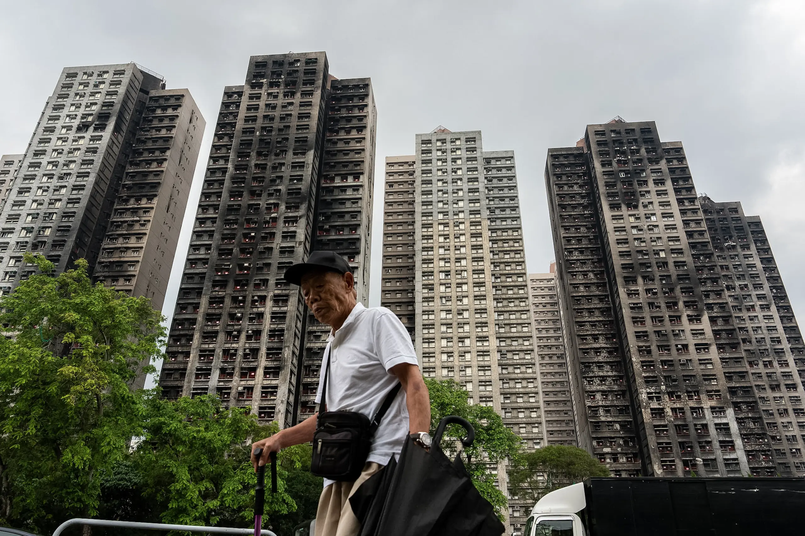 Hong Kong's housing minister resigns after fire investigation finds ...