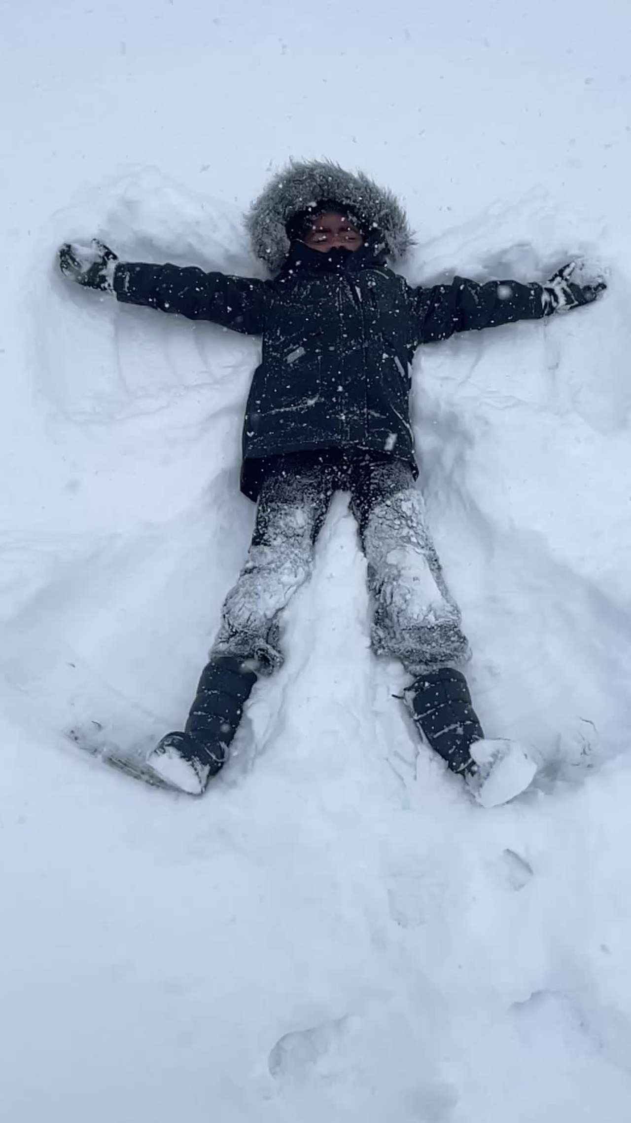 Elani making a Snow Angel