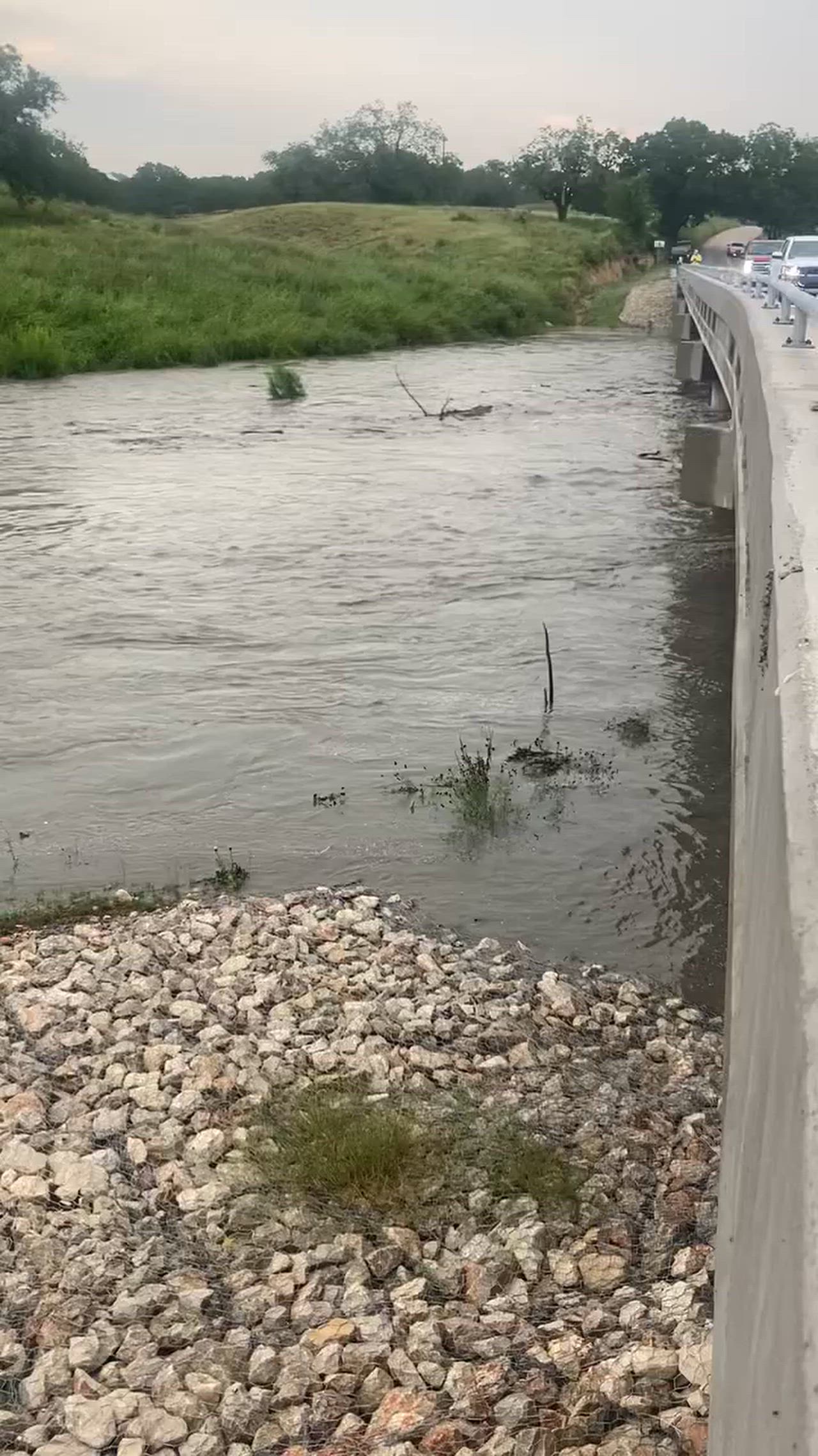 7 pm , flooding just under the new bridge at Pipe Creek , just up from Medina . There is usually very little water (half foot)
