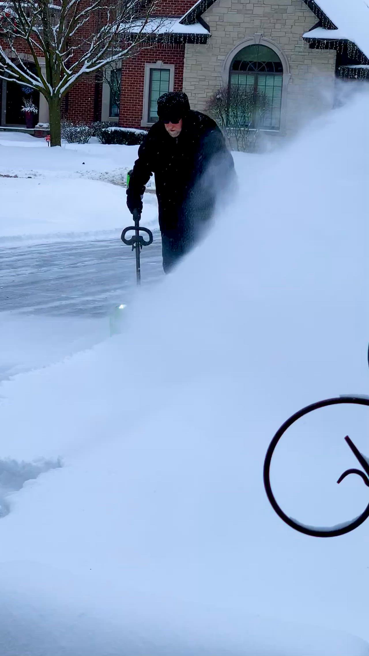 Here’s Mitch happy to find the battery shovel works on 5 inches of snow!